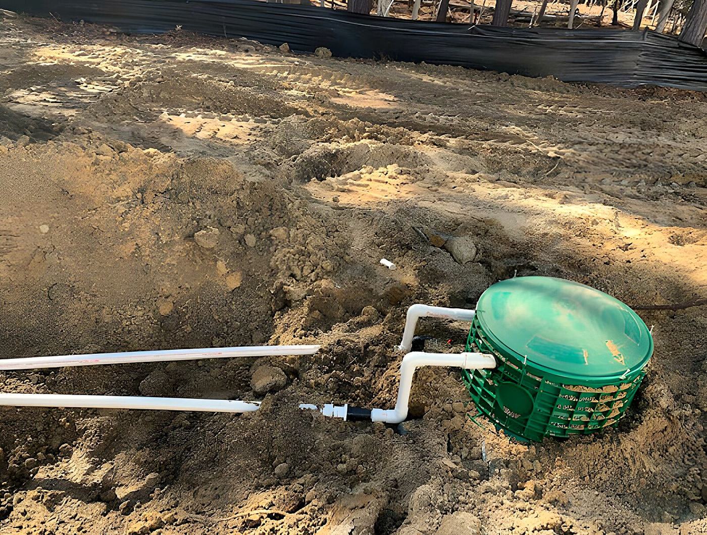 Fuji Clean ATU installed with green access lids in sandy soil