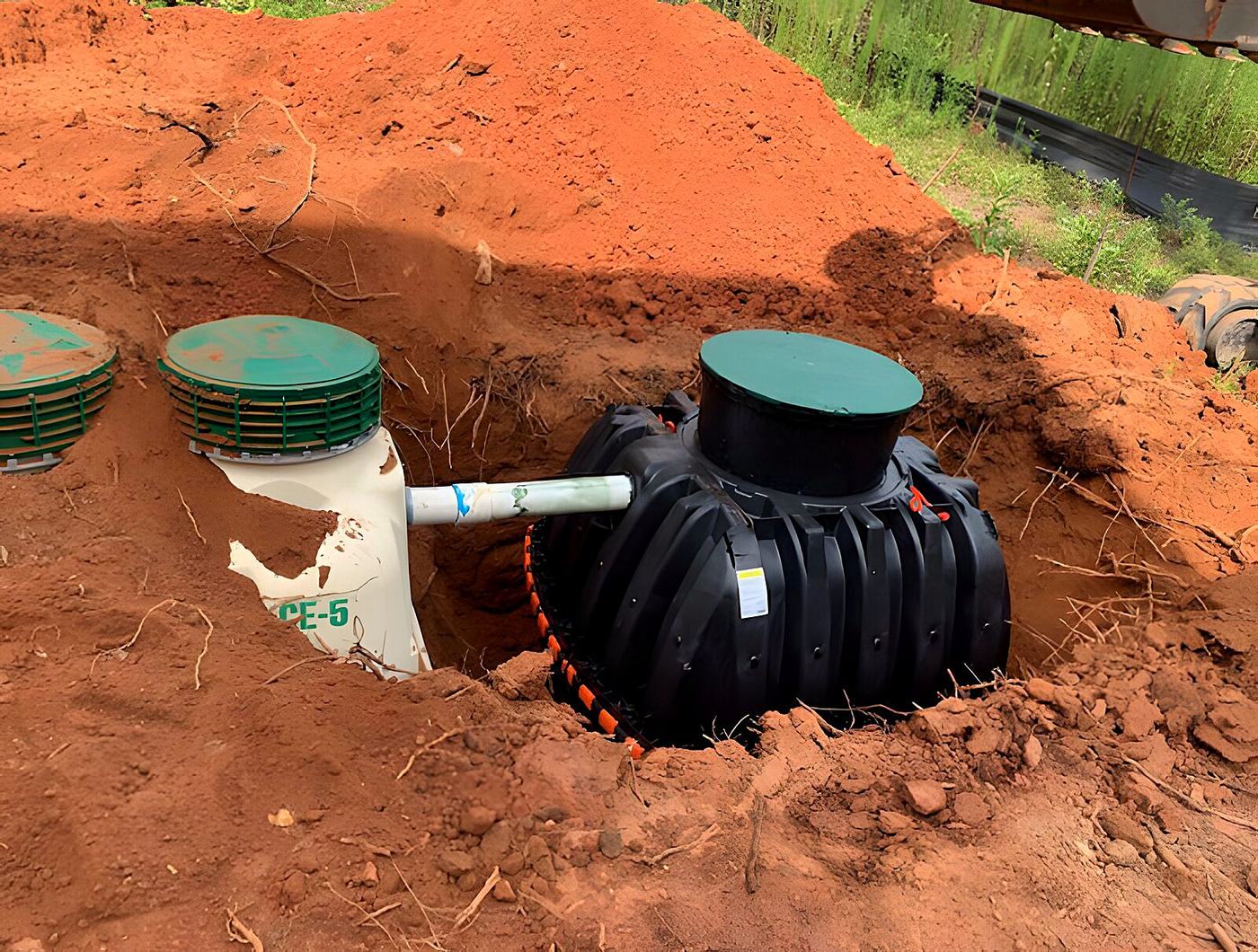 Drain field pipe laid with fresh fill over clay